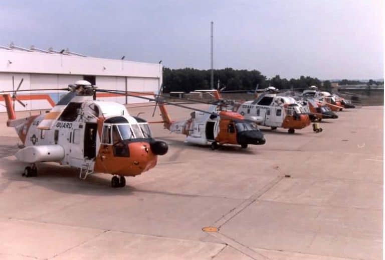 HH-3F helicopter in foreground, HH-60J next in line