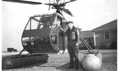 CDR Erickson Standing – LT Bolton in the helicopter